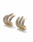 Queens Candy gold plated brass hoop earrings with three intertwined rows of small purple stones.