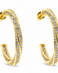 Pendientes de aro Queens Candy con diseño de doble vuelta, baño dorado y zirconias brillantes en estilo pavé.