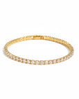 Pulsera tennis Queens Candy dorada con zirconias blancas redondas sobre fondo blanco