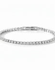 Pulsera tennis Queens Candy en cobre con baño platinum y zirconias cúbicas brillantes de 2.5mm con cierre elegante.
