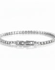 Pulsera tennis Queens Candy en cobre con baño platinum y zirconias cúbicas brillantes de 2.5mm con cierre elegante