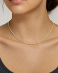 2mm Moissanite Tennis Necklace Gold de 16 pulgadas puesto en modelo - Queens Candy
