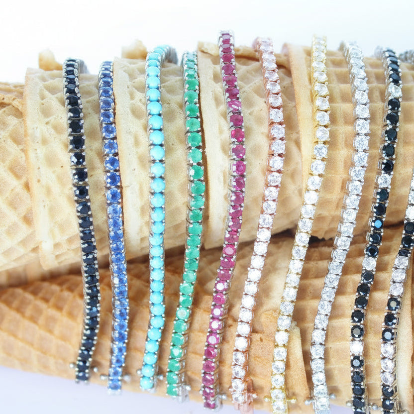 different color tennis bracelets over waffle cones