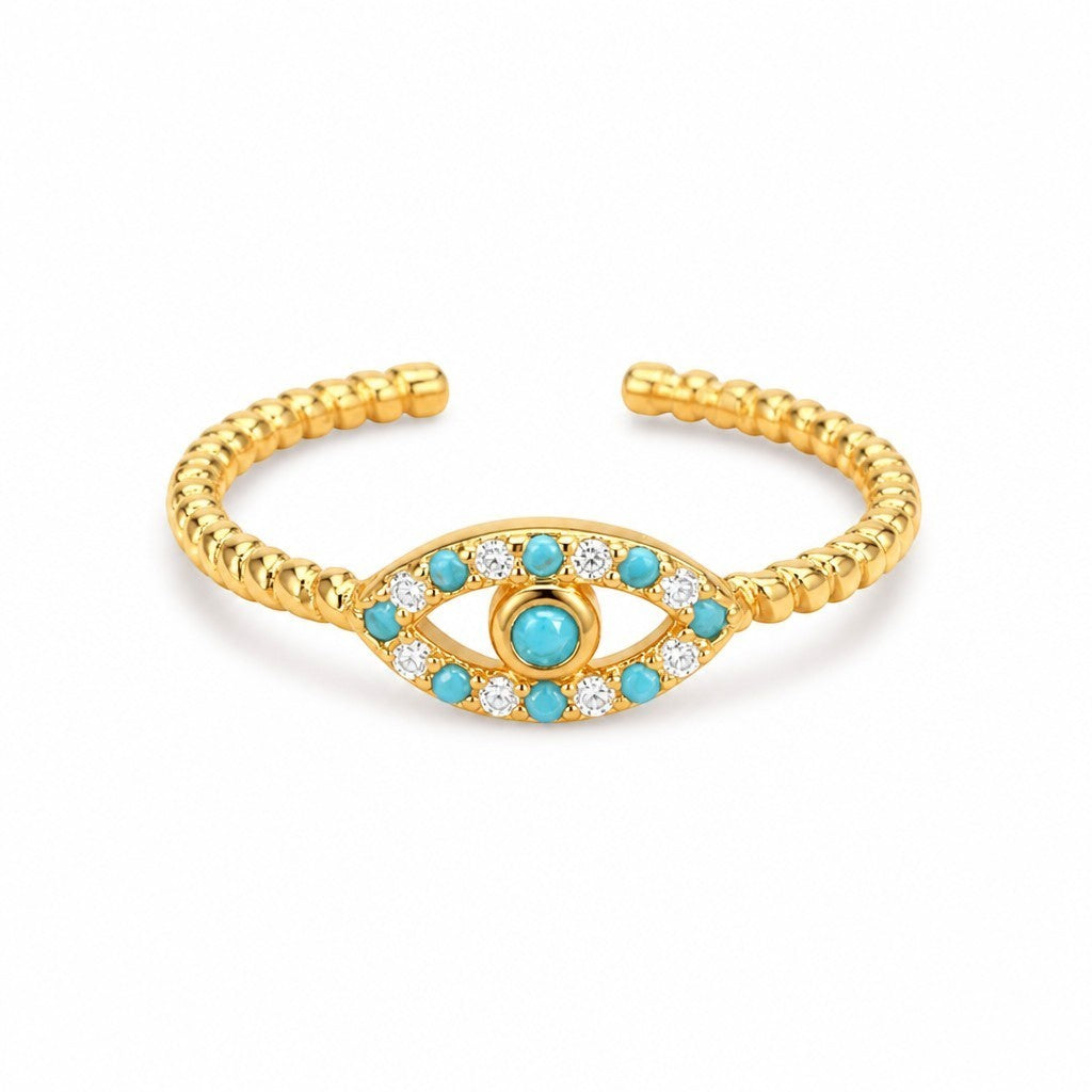 Anillo ajustable Queens Candy de latón bañado en oro con diseño de ojo turco, zirconias y turquesas sintéticas.