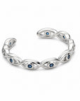 Anillo ajustable Queens Candy de metal plateado con diseño de ojos turcos y zirconias azules brillantes