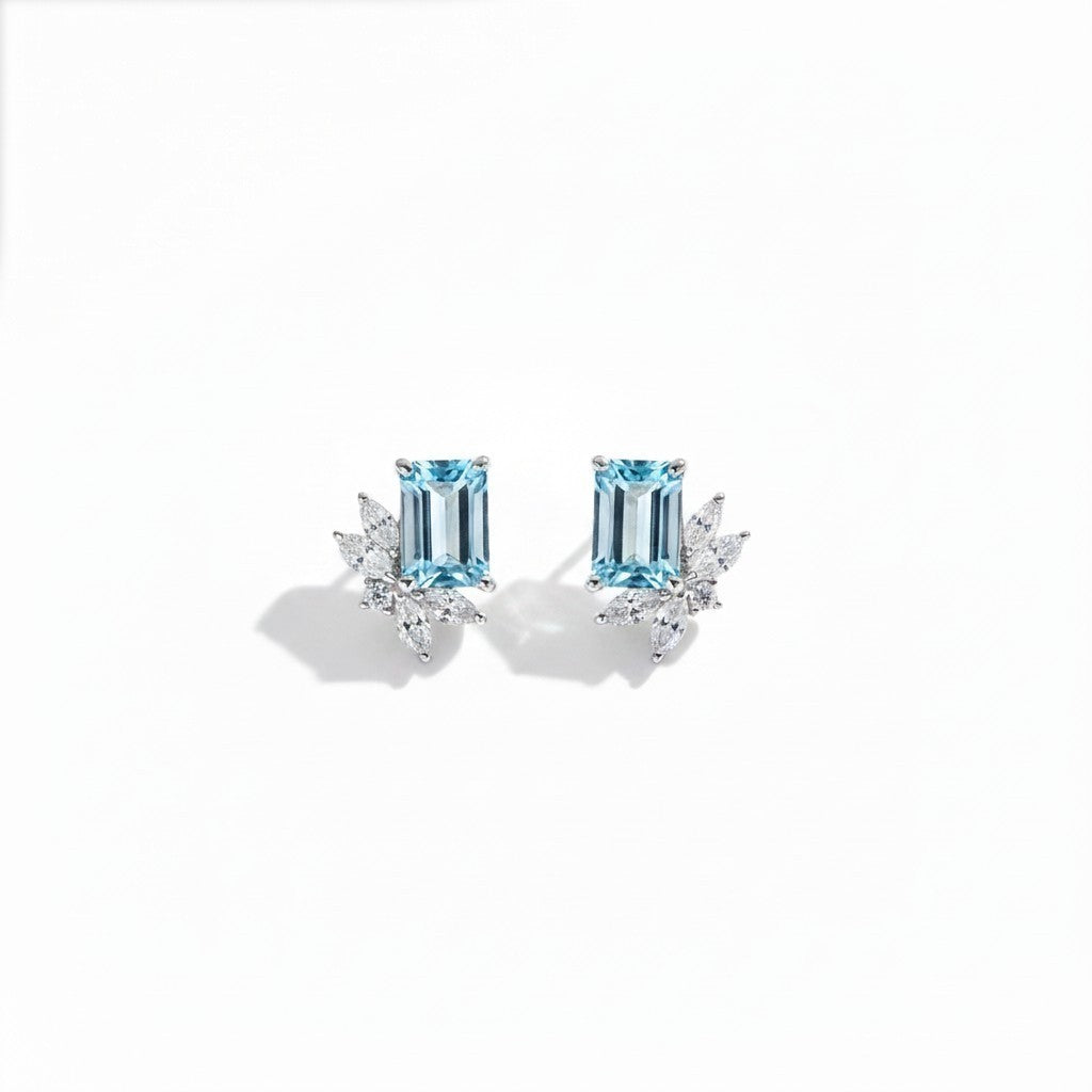Queens Candy gold-plated sterling silver stud earrings featuring rectangular aquamarine and marquise cubic zirconia.