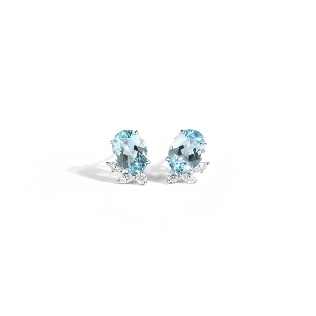 Queens Candy gold-plated sterling silver stud earrings featuring oval aquamarine stones and marquise cubic zirconia.