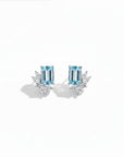 Queens Candy gold-plated sterling silver stud earrings featuring rectangular aquamarine and marquise cubic zirconia.