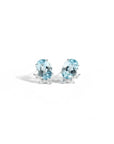Queens Candy gold-plated sterling silver stud earrings featuring oval aquamarine stones and marquise cubic zirconia.