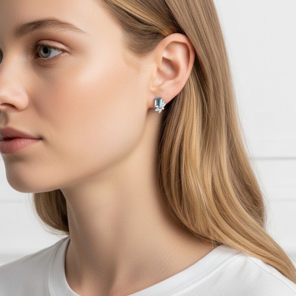 Queens Candy Sugared Gem stud earrings featuring a rectangular aquamarine stone and marquise cubic zirconia on gold