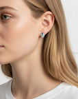 Queens Candy Sugared Gem stud earrings featuring a rectangular aquamarine stone and marquise cubic zirconia on gold