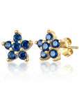 Aretes tipo stud Queens Candy con forma de flor en plata 925 bañada en oro y zirconias cúbicas azules de 5mm.