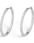 Aretes hoop Queens Candy de 26mm en cobre con baño plateado y zirconias brillantes en todo el aro.