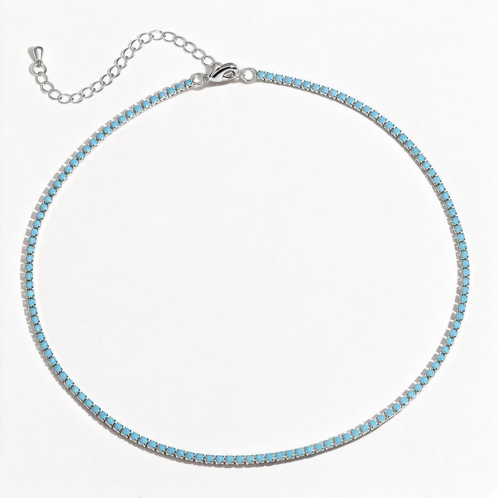 Collar tennis Queens Candy de cobre con baño de rodio plateado y zirconias cúbicas redondas de color turquesa.