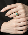 Queens Candy adjustable gold-plated sterling silver ring with a heart-shaped turquoise stone and ribbed band