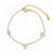 Pulsera Queens Candy de cobre bañado en oro con dijes de hamsa, estrella y símbolo chai decorados con zirconias.