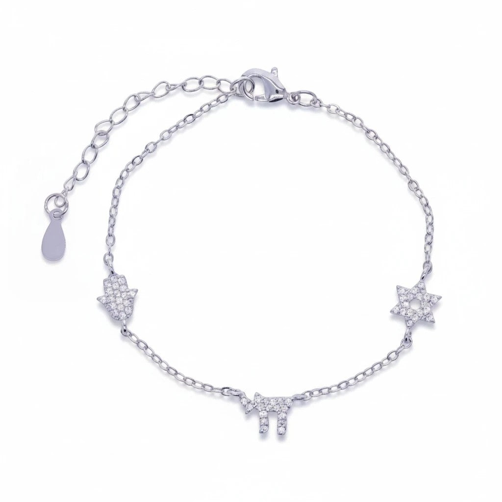 Pulsera Queens Candy de plata con dijes de hamsa, estrella de David y chai decorados con zirconias brillantes