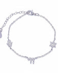 Pulsera Queens Candy de plata con dijes de hamsa, estrella de David y chai decorados con zirconias brillantes