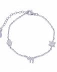 Pulsera Queens Candy de plata con dijes de hamsa, estrella de David y chai decorados con zirconias brillantes