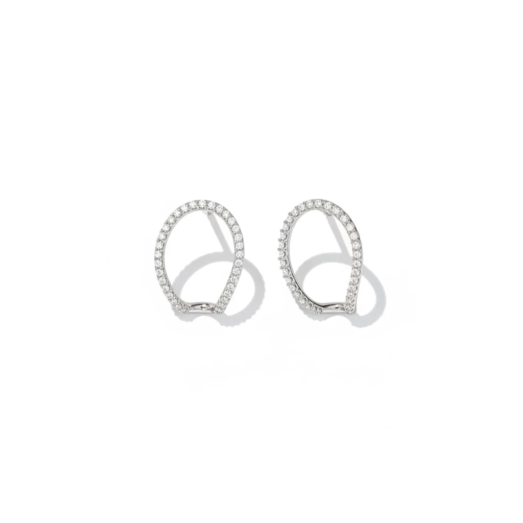 Queens Candy sterling silver irregular hugger earrings with pavé cubic zirconia stones on a white background