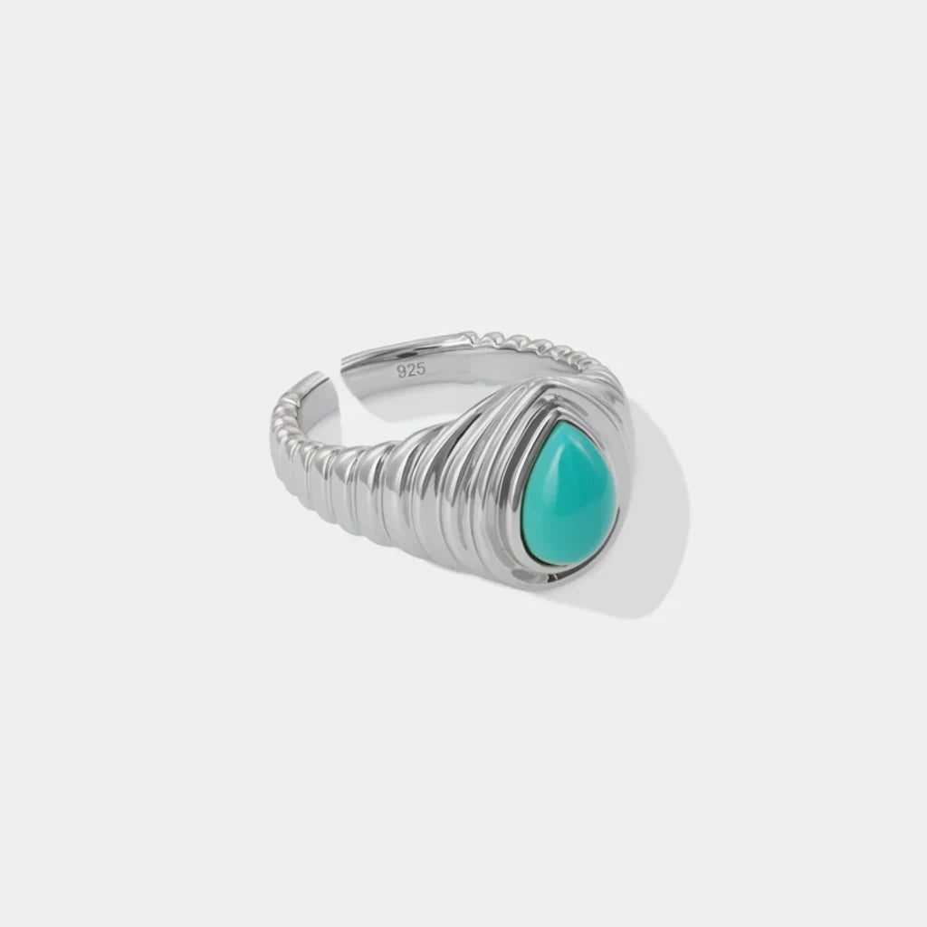 Queens Candy adjustable silver 925 ring featuring a teardrop-shaped turquoise stone and a ribbed band design.