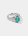 Queens Candy adjustable silver 925 ring featuring a teardrop-shaped turquoise stone and a ribbed band design.